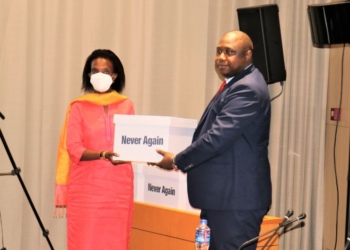 The Gambian Attorney General and Minister of Justice Dawda A. Jallow handing copies of the final report of the Truth, Reconciliation and Reparations Commission to the UN representative in Bijilo, The Gambia, on December 24, 2021.