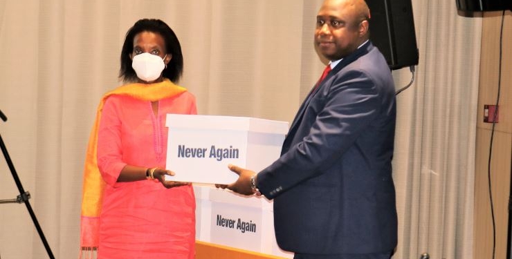 The Gambian Attorney General and Minister of Justice Dawda A. Jallow handing copies of the final report of the Truth, Reconciliation and Reparations Commission to the UN representative in Bijilo, The Gambia, on December 24, 2021.